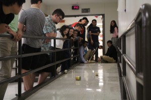 Ms. Drake's AP Physics C students roll cans down the upstairs ramp. 