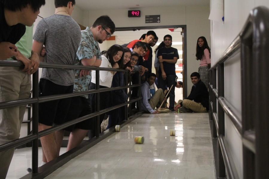 Ms. Drakes AP Physics C students roll cans down the upstairs ramp. 