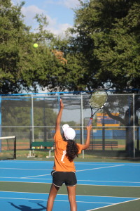 Pritika Paramasiram '19 serves the ball. 