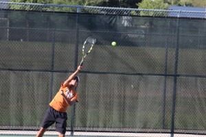 Nathan Iyer '19 serves the ball to his opponent. 