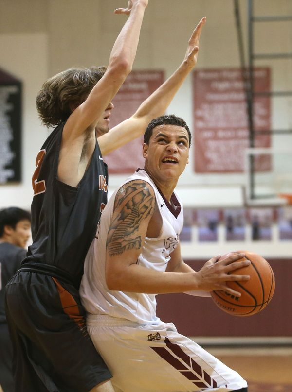 Boys' Varsity Basketball Remains Undefeated against Rouse Raiders