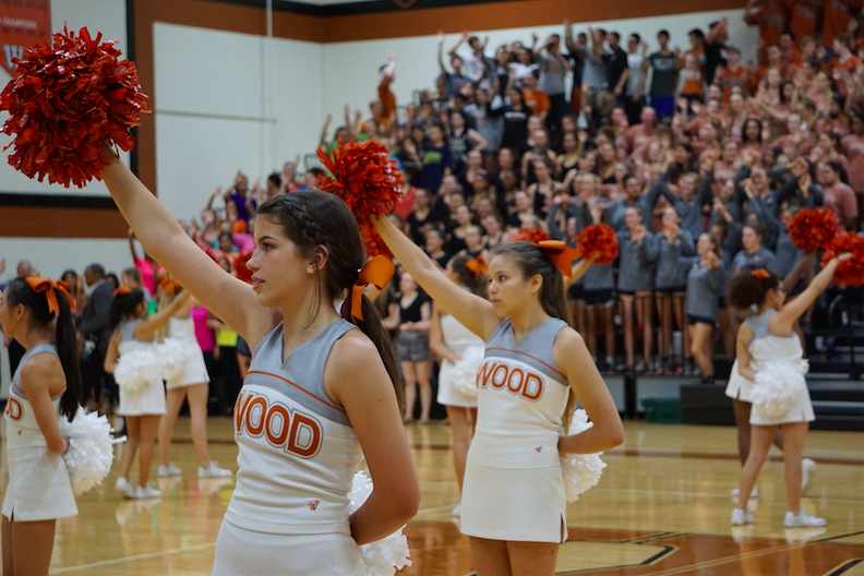 Cheerleaders lead the crowd as the alma mater is played.