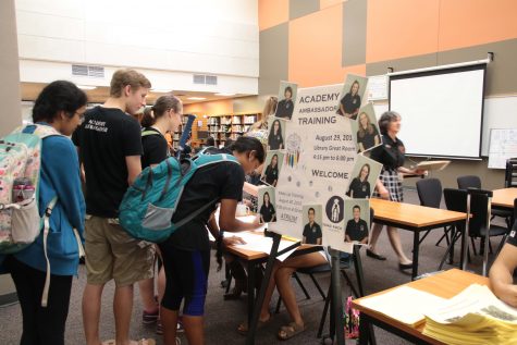 Ambassadors sign in to show their participation in the event.