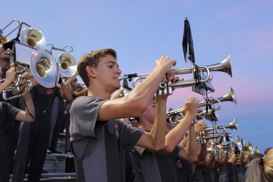 John Cauvin 17 plays standtunes during a football game.