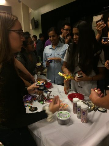 HOSA Members serve themselves ice cream.