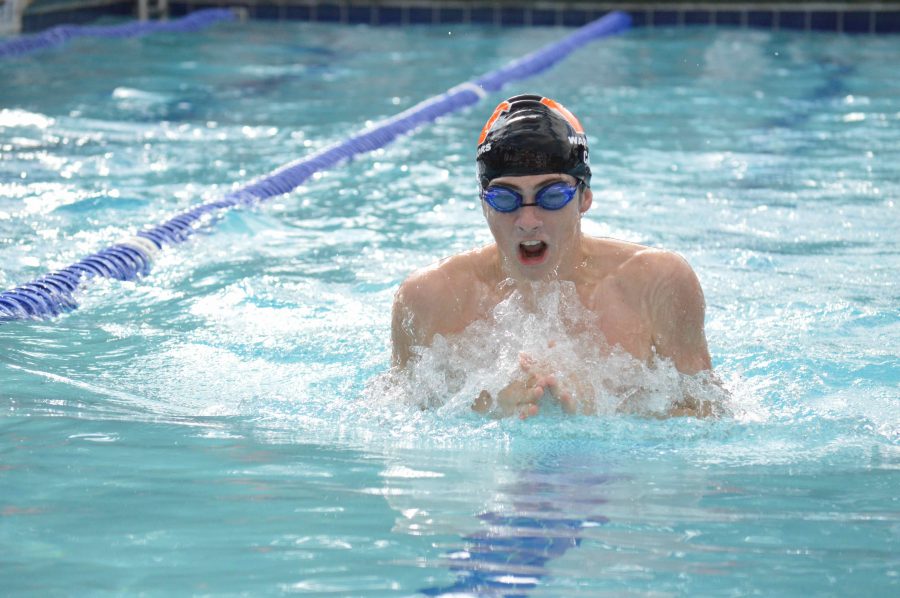 Ryan Cain 17 prepares to finish a stroke in the 100-yard breaststroke event, where he finished second.