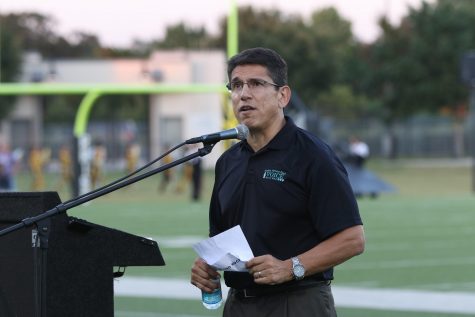 Superintendent Steve Flores announcing the bands of the district. 