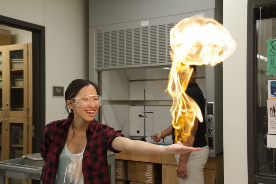 With a mushroom looking fireball in her hand, Jasmine Phan 17 watches in amazement. 