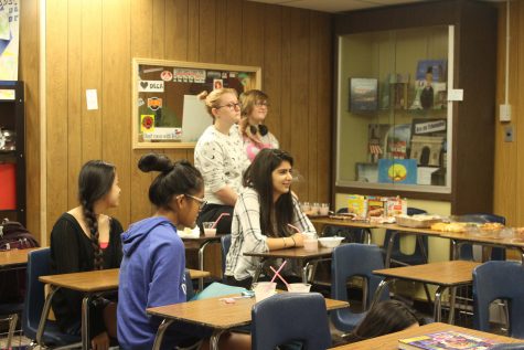 Members listen carefully to what Nurse Rita Chavez has to say about mental health. 