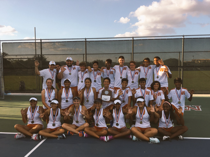The team poses with the plaque following their seventh consecutive district win. Photo Credit: Westwood Tennis