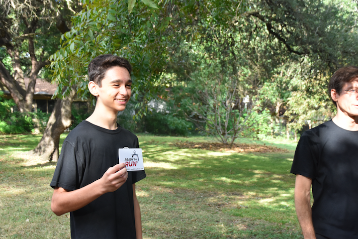 Paul Camardo ‘19 poses in front of the camera after receiving his gift card for winning the event raffle. 