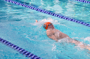 Rory Gatson '17 races in the 100-yard backstroke event.