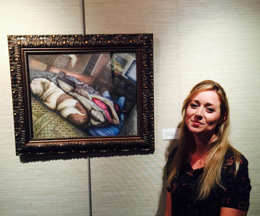 Westwood art teacher Ms. Brittany Skillern poses with her mixed media piece, Illuminated Intimacy.