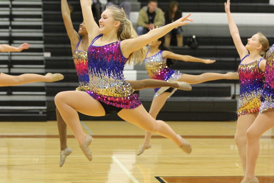 Sydney Busfield 18 leaps along with her fellow SunDancers.