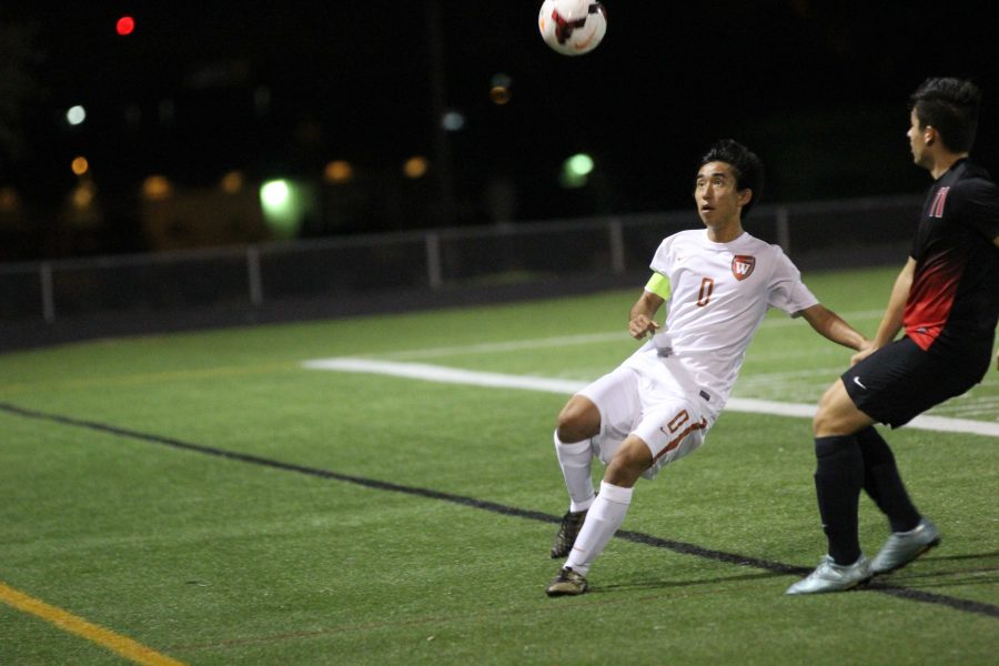 Captain Liam Matsumoto 17 keeps his eye on the ball before grounding it. 
