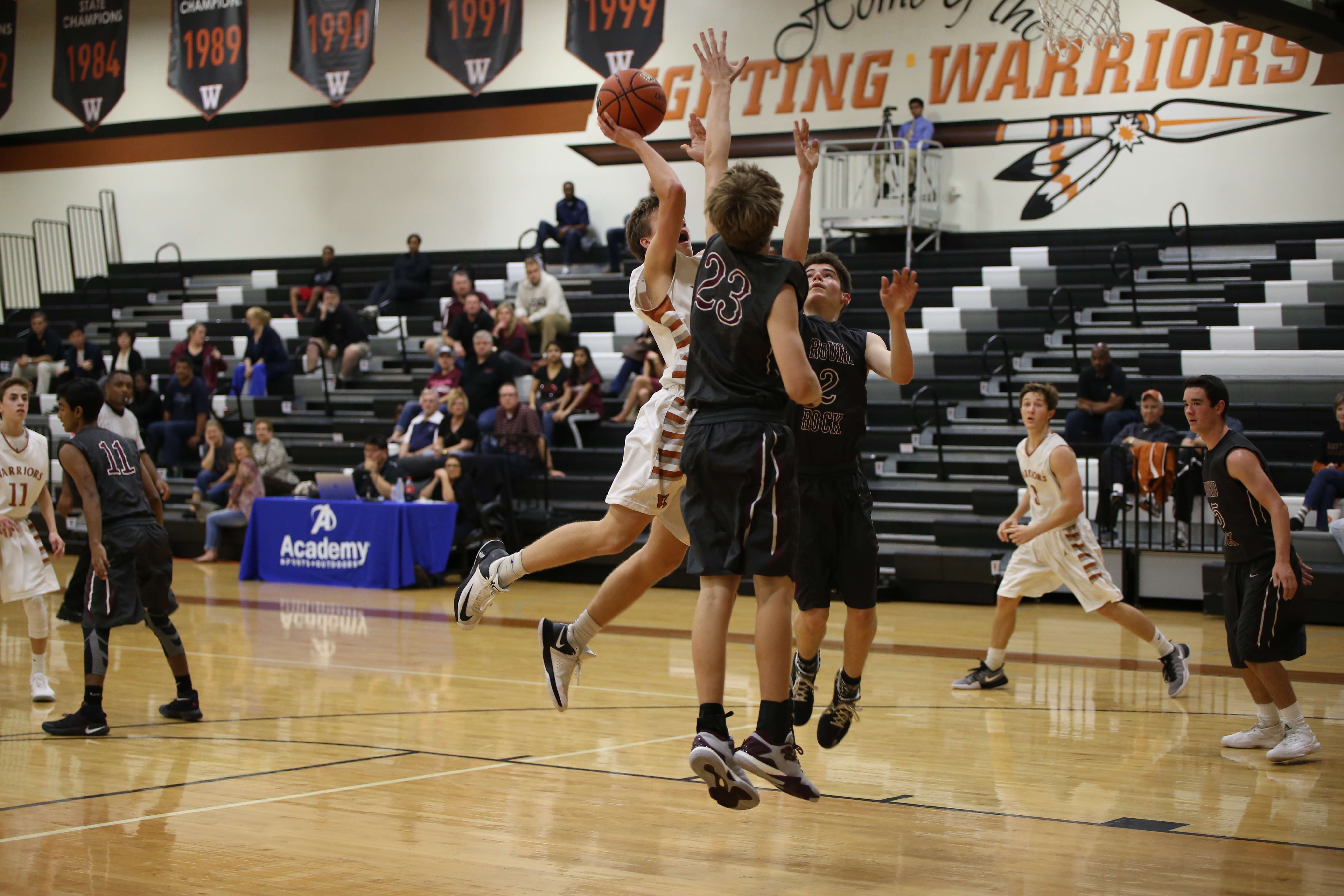 JV Boys' Basketball Defeats RR Dragons in 3OT