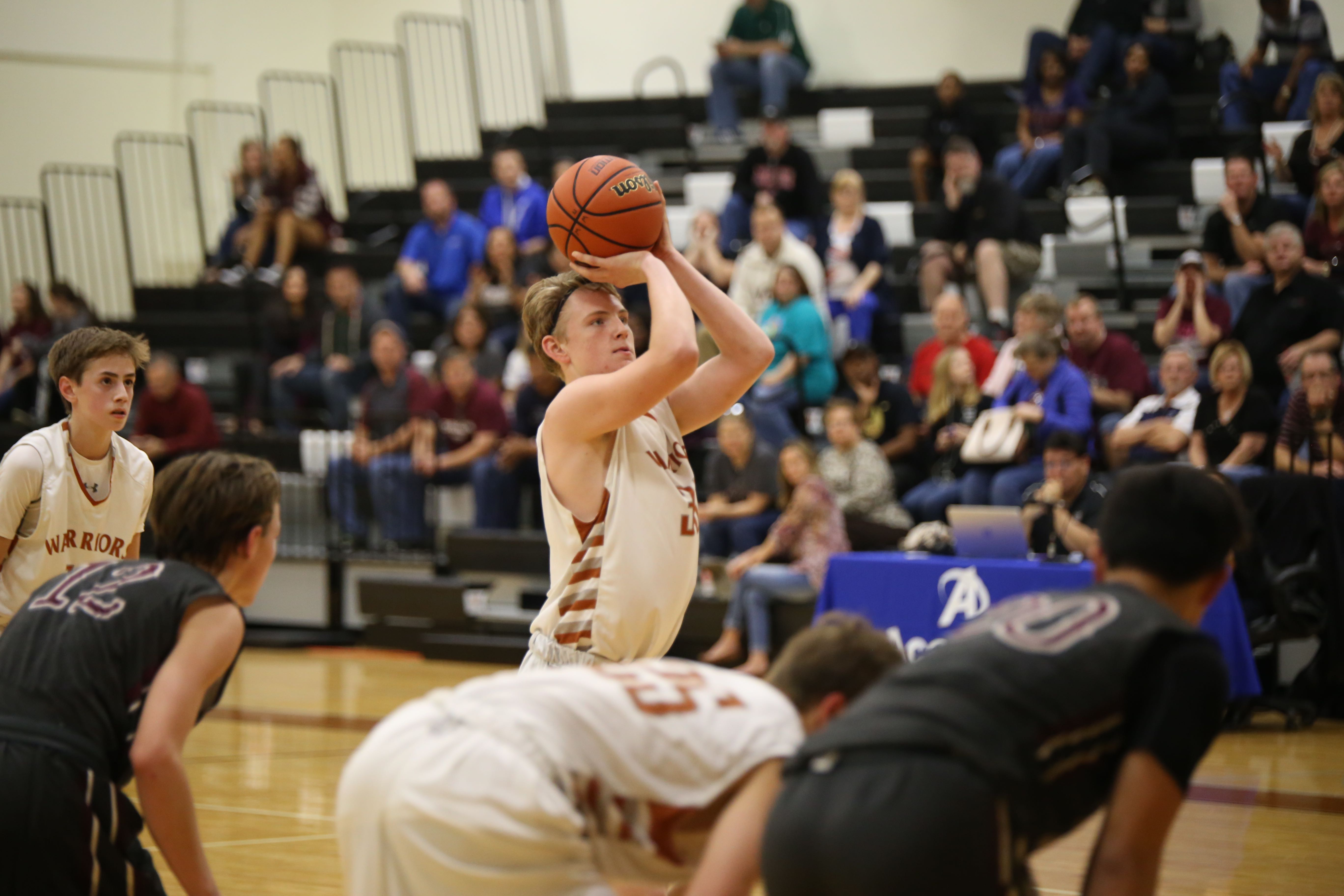 JV Boys' Basketball Defeats RR Dragons in 3OT