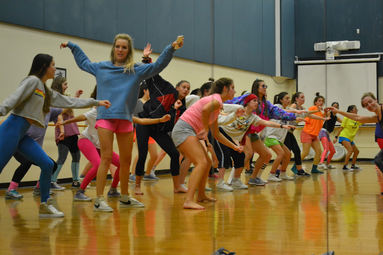 The Pacesetter girls try to figure out the next dance move.
