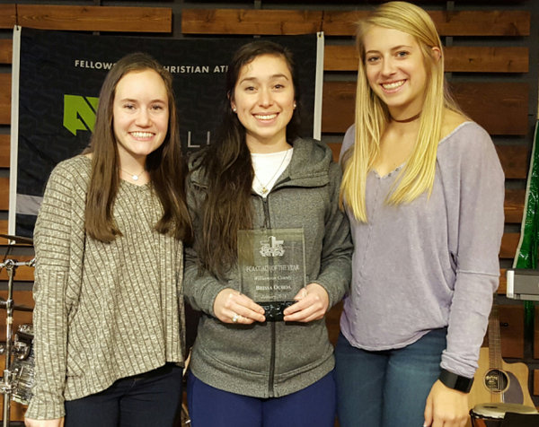 Volleyball coach Brissa Ochoa poses with two former club members.