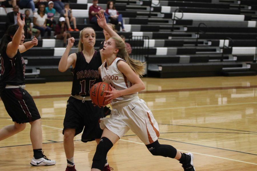 After making her way through the defenders, Jenny Todd 19 shoots a two-pointer.