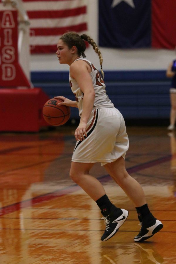 Madison Couch 19 dribbles the ball.