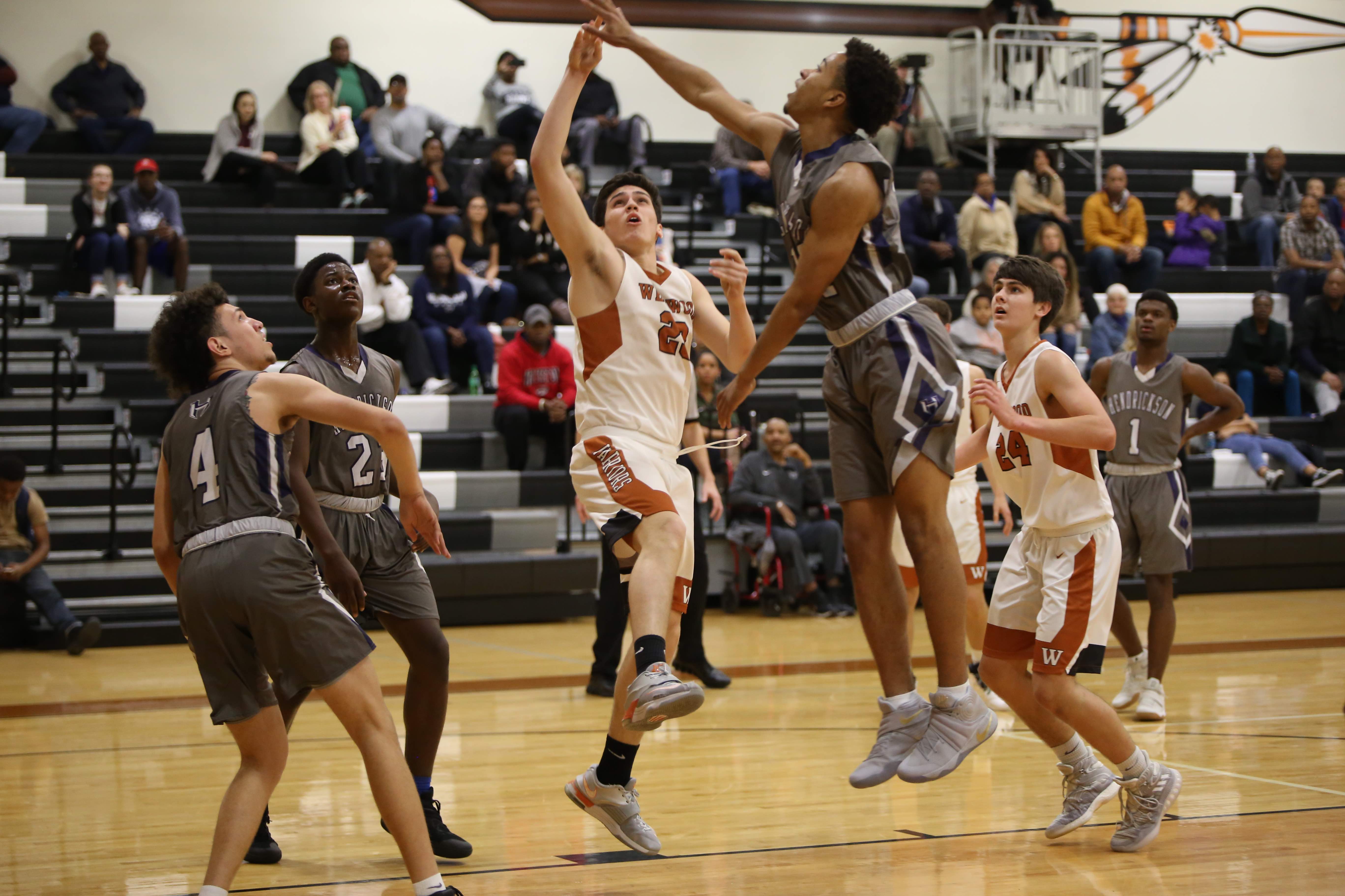 GALLERY: Varsity Boys' Basketball Falls Short Against Hendrickson