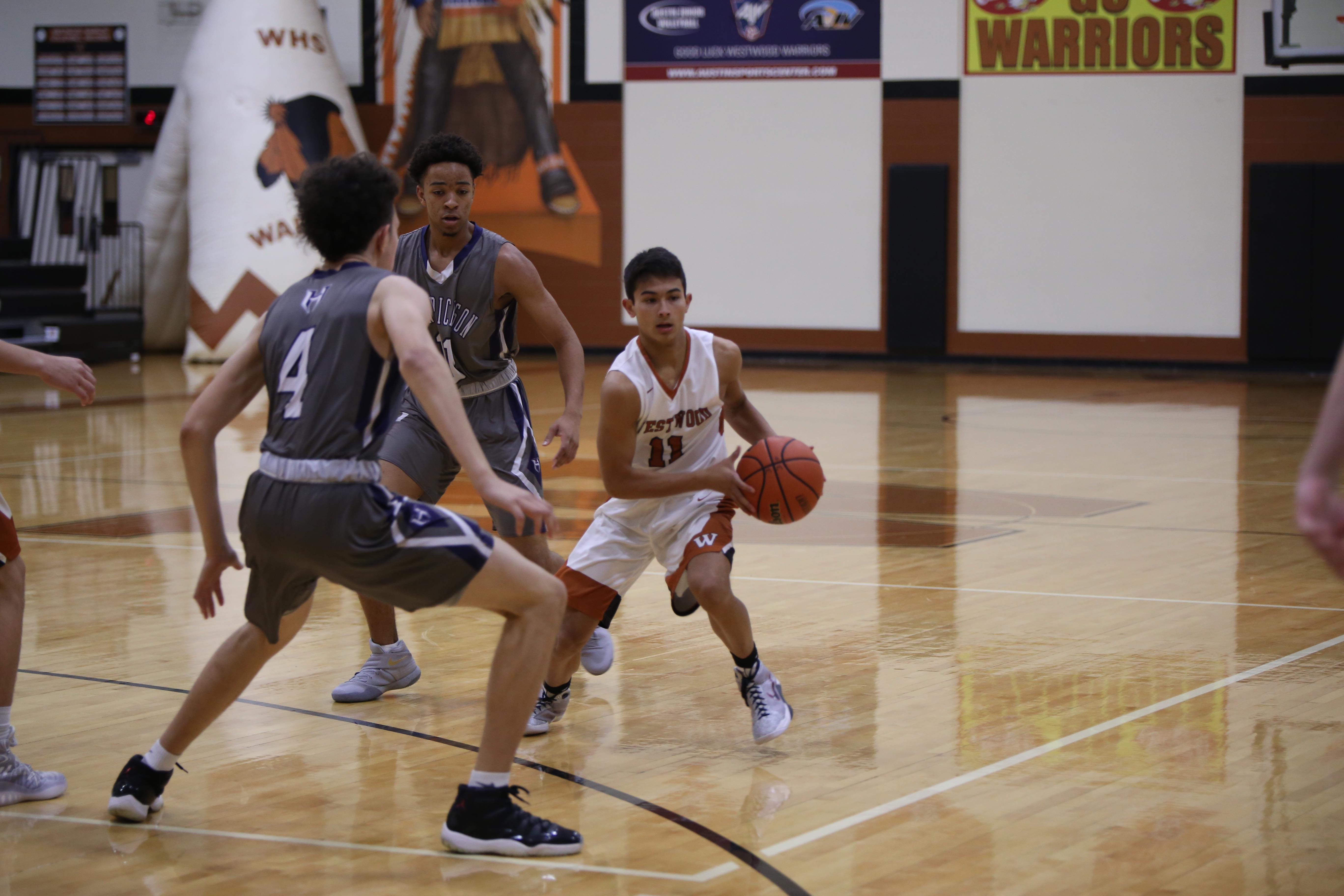 GALLERY: Varsity Boys' Basketball Falls Short Against Hendrickson