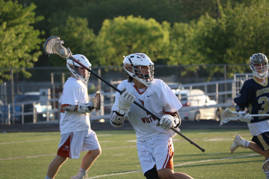Jack Mattson ‘18 looks for an open teammate after a successful clear from the goalie.