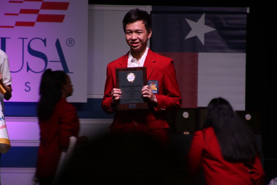 Phoenix Wang 18 proudly accepts his 2nd place award in Related Technical Math. 
