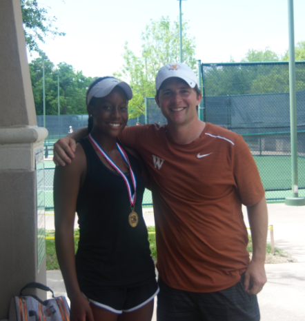 Kiana Graham '20 poses with head tennis coach Travis Dalrymple following her regionals win. Photo credit to Westwood Tennis