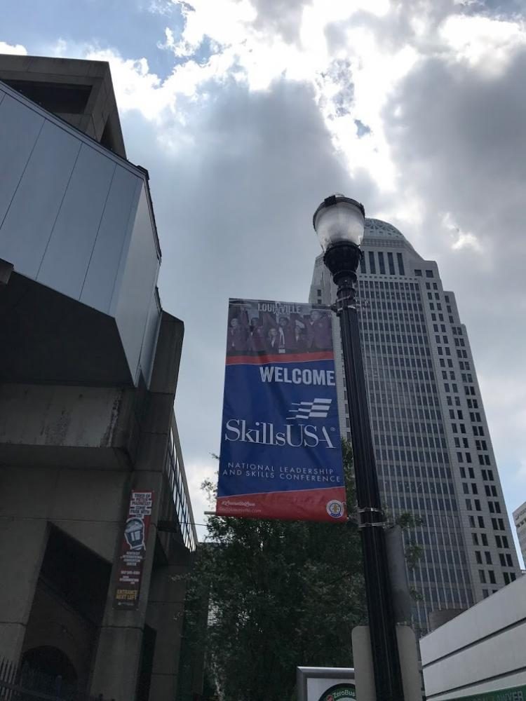 A welcoming banner hangs on 4th St..
