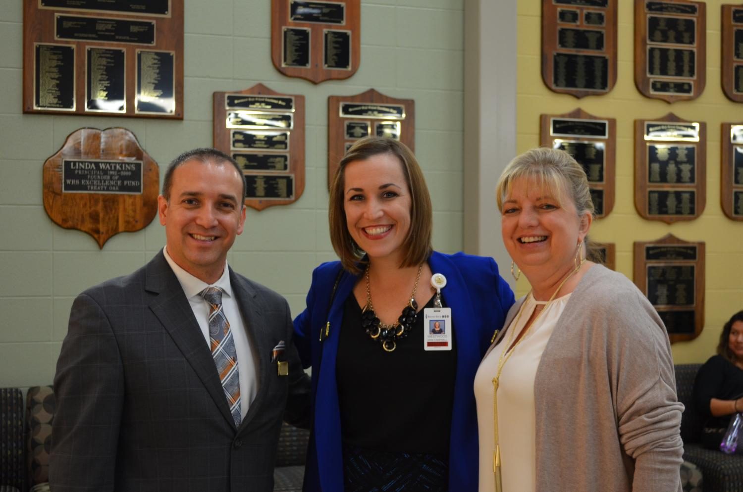Principal Mr. Mario Acosta, Assistant Principal Erin Campbell, and Associate Principal Kim Hodge smile as they welcome the parents for this year’s Open House