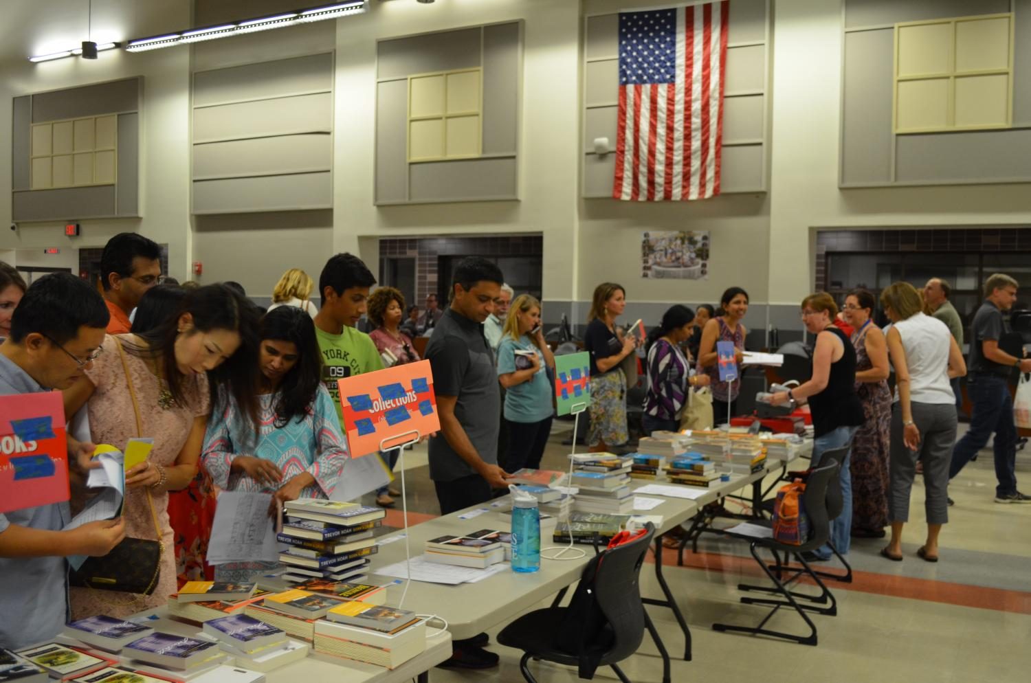 Parents stand in line to buy books for the upcoming school year.