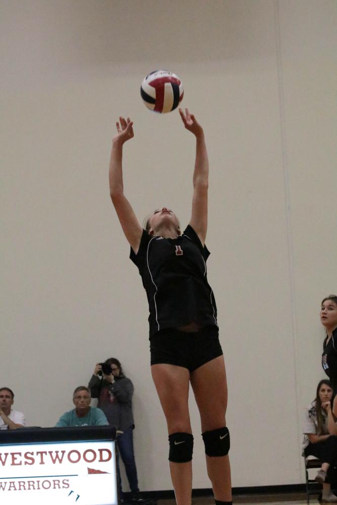 Samantha Snow 21 back sets to right side hitter.