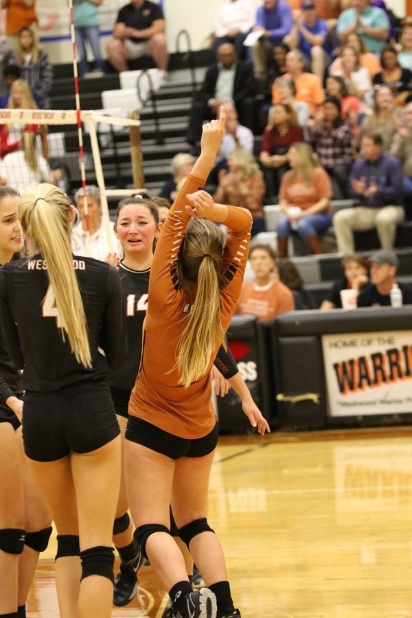 Lady Warriors rejoice at scoring a kill against Anderson.