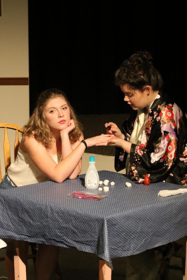 Nicole Boisseau 20 gets her nails painted by her on-stage aunt, Catie Dugan 18,
