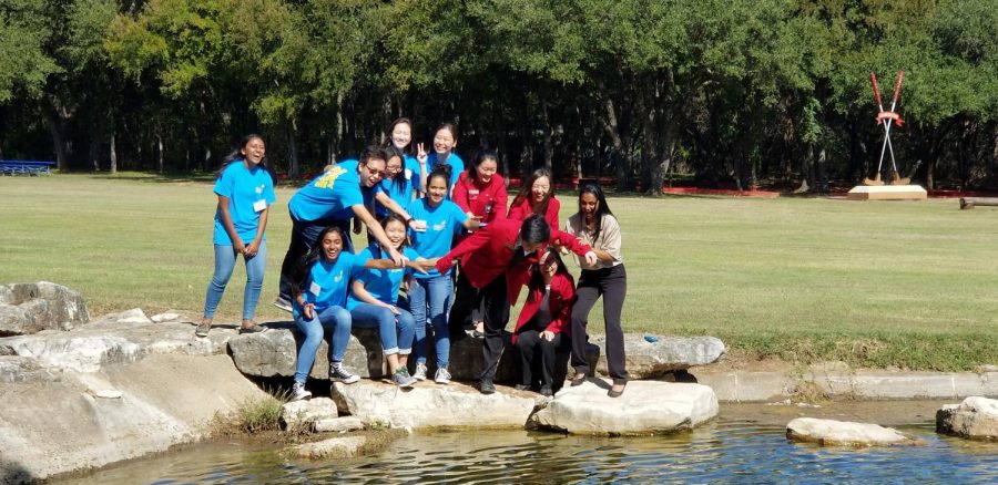 Westwood SkillsUSA officers mime pushing District President James Joh ‘19 into the pond. Photo courtesy of Ms. Tiffany Carpenter.