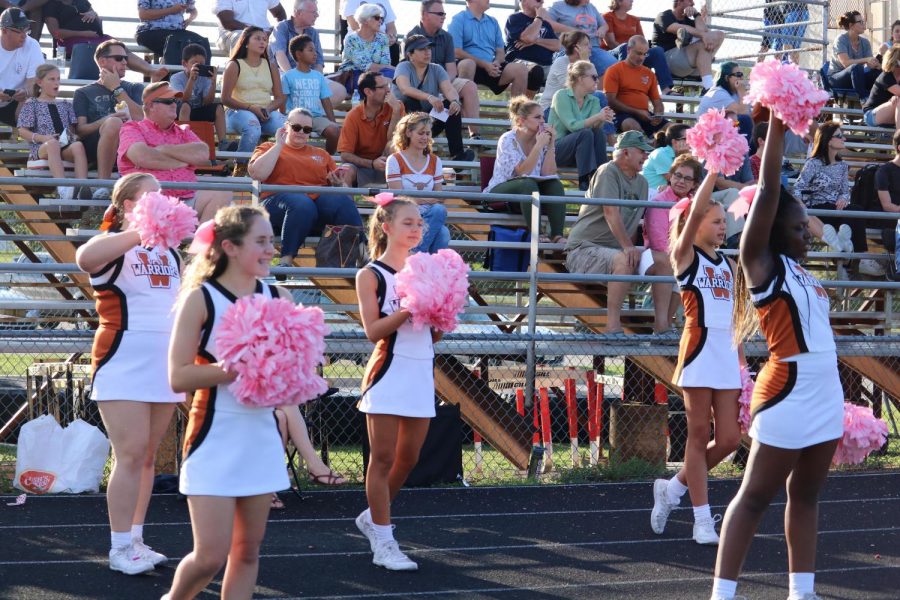 Cheerleaders cheer on the Warriors during a timeout. 