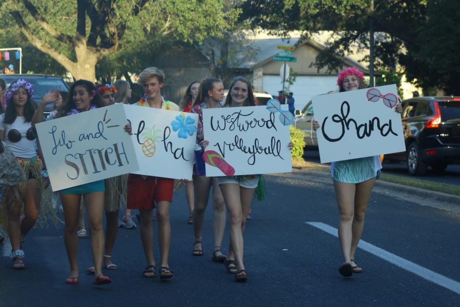 The volleyball teams dress up as Lilo and Stitch for the parade. 