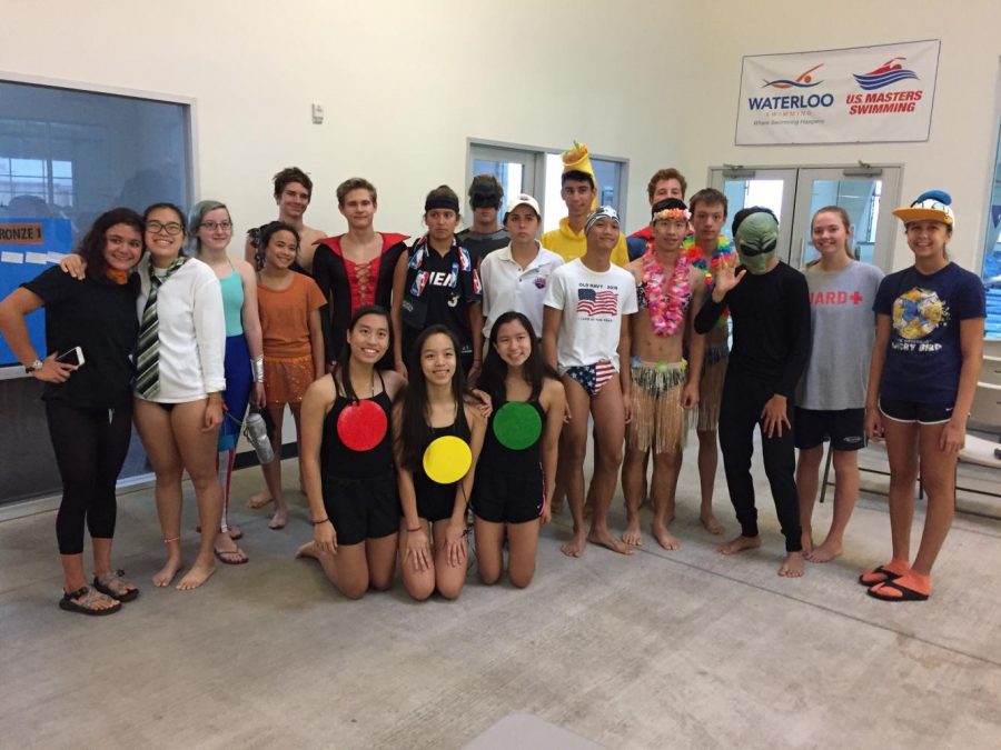 The swimmers gather for a group picture before swimming their laps.
