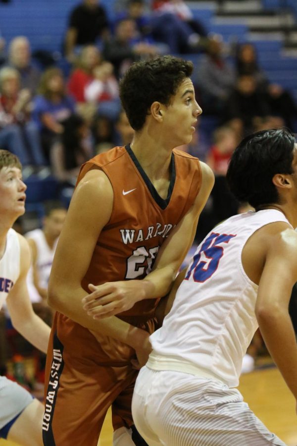 Christian Robinson 20 is ready to snag a rebound while against Leander defense. 