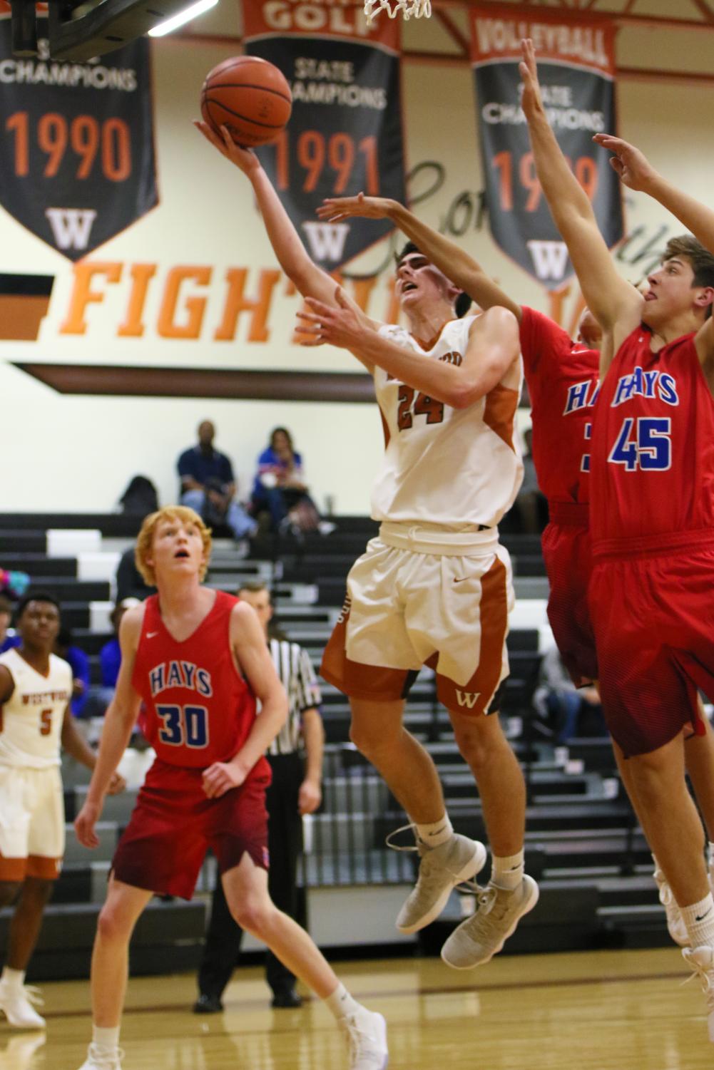Varsity+Boys+Basketball+Conquers+the+Hays+Rebels+59-49