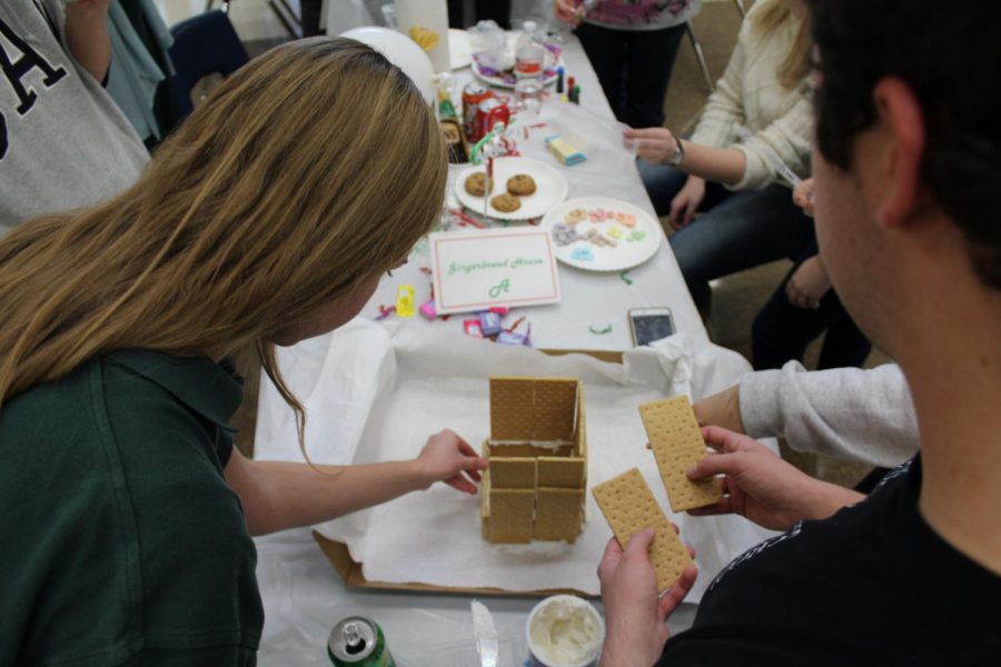 Groups start to construct their gingerbread house for the competition.