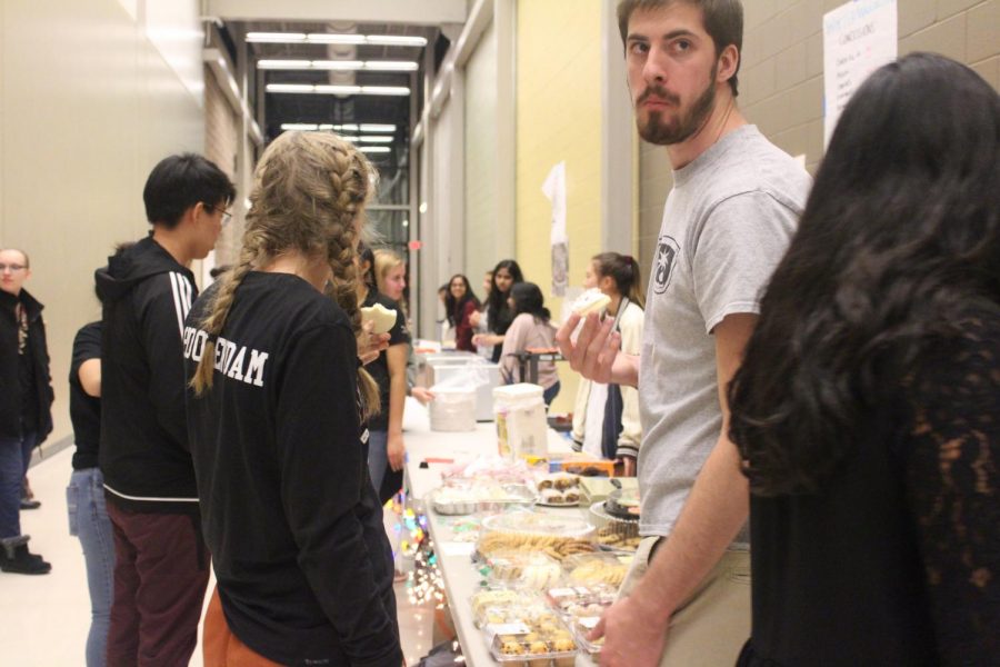Students gather to sell and purchase baked goods.
