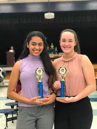 Elisa Baxter 19 and Sruthi Ramaswamy 20 smile as they hold their awards.
