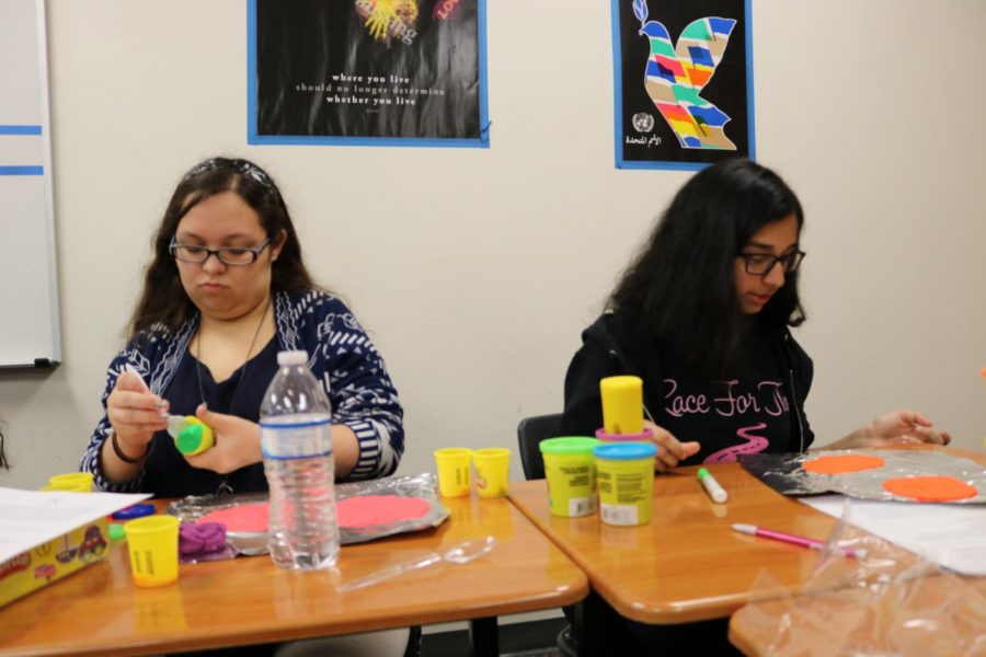 Nuha Momin 11 and Tiana Tulloch 12 individually work on their play-doh brains in psychology class.