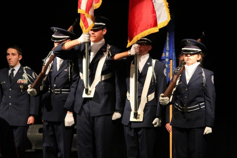 The Color Guard prepares to present the flag.