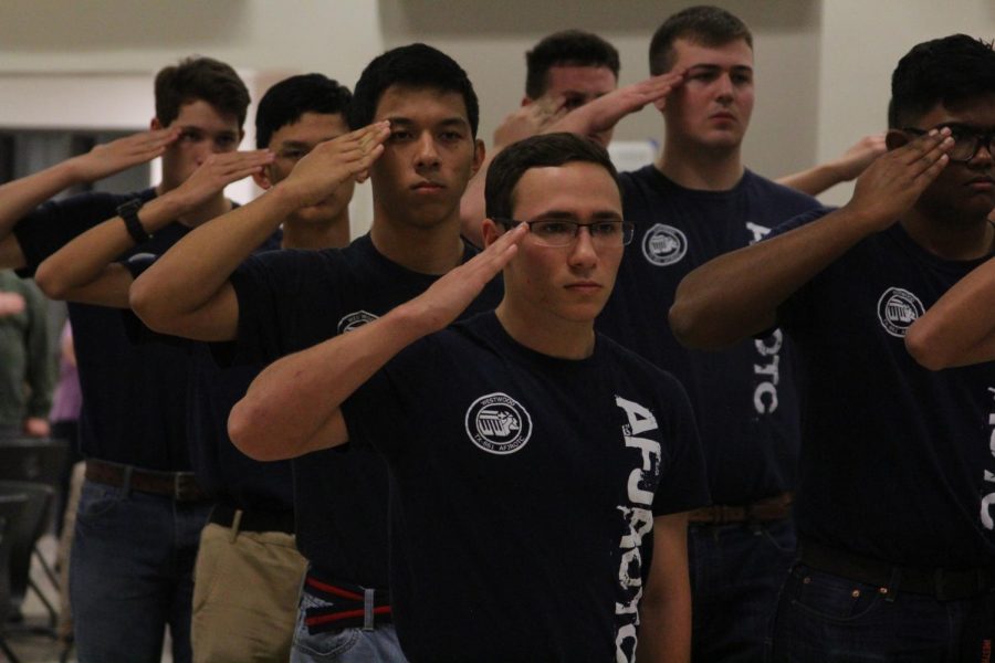 Myles Martinez 19 salutes along with the rest of his squadron.