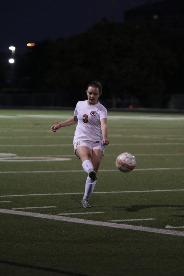 Shelby Gregory 21 clears the ball from the defensive third of the field.