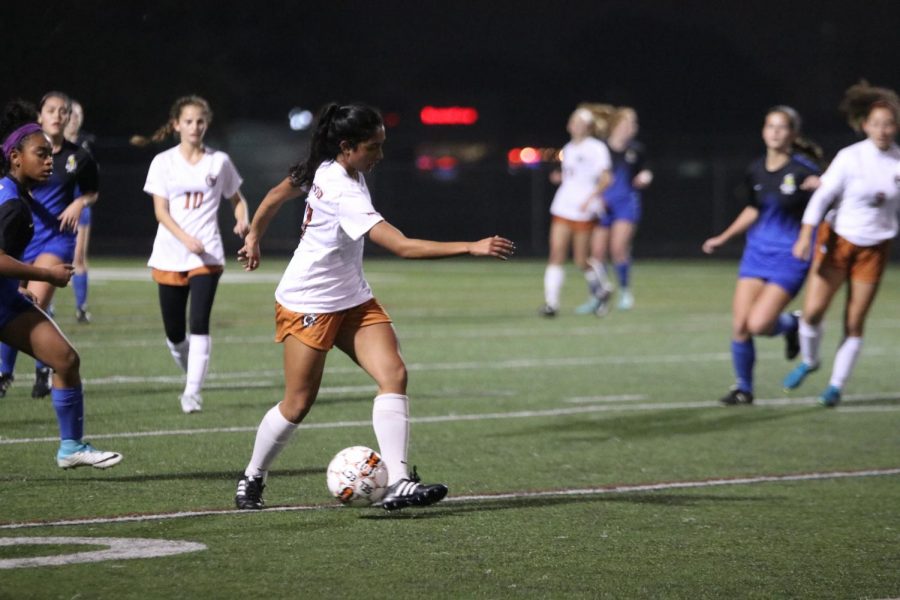 Asha Samson 18 dribbles up the field to get a shot off. 